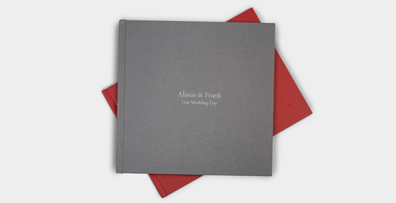Image of coffee table book with grey linen cover and personalised text