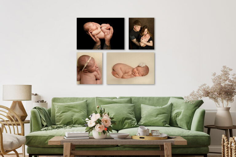 A sitting room with green sofa and coffee table, showing collection of framed newborn baby photos on the wall behind.