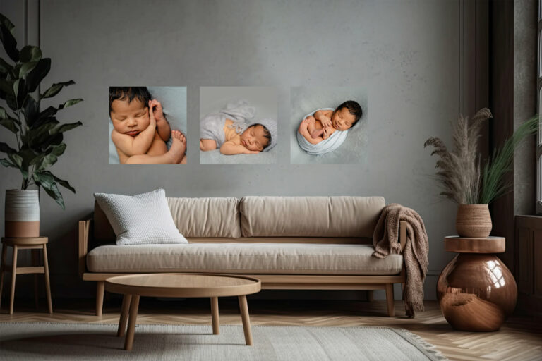 Image of a modern sitting room with three pieces of wall art displaying images of a newborn baby from a photoshoot in Hampshire.