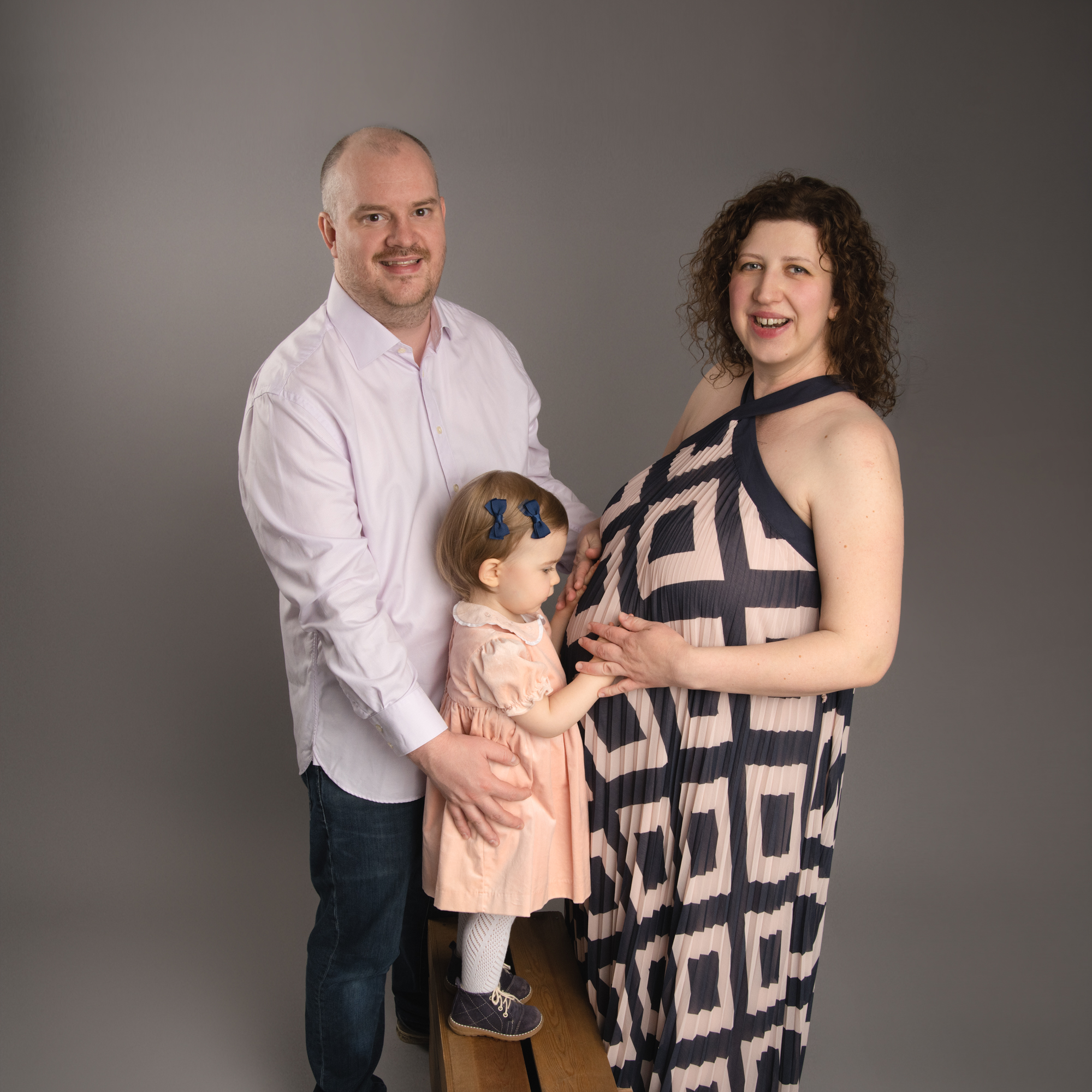 Family of three awaiting the arrival of a new baby