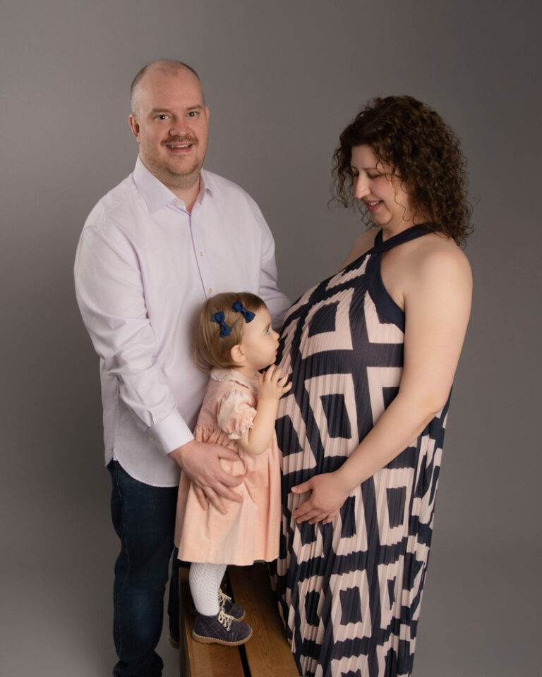 Parents to be with toddler at H Jones Photography maternity shoot near Southampton