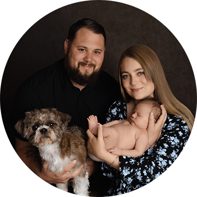 Couple with newborn baby and dog at Hampshire photoshoot
