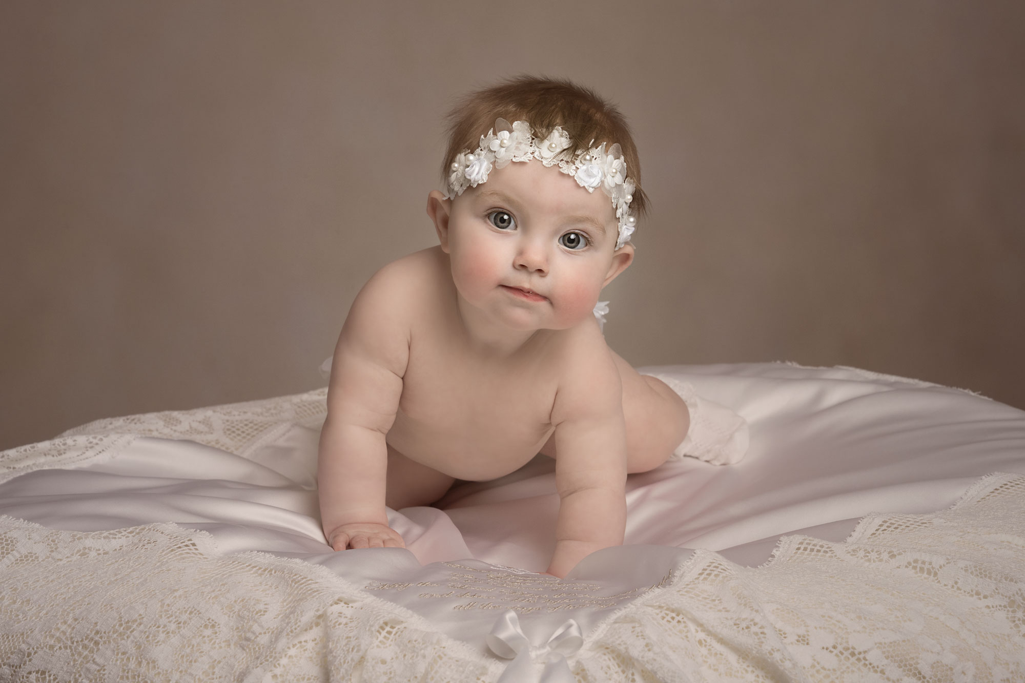 Baby crawling during a Sitter Session photoshoot in Andover, Hampshire, by H Jones Photography.