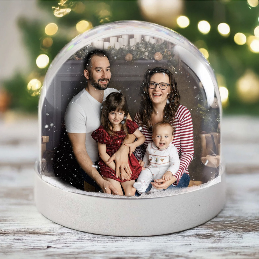 Snow globe containing a family portrait by H Jones Photography