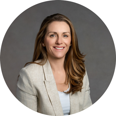 Professional headshot of a smiling woman in a neutral studio setting for business profile, photographed near Andover, Hampshire