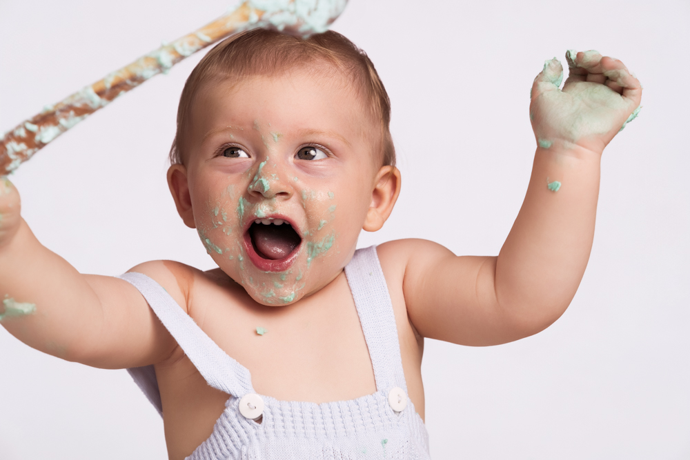 One year old celebrating his first birthday cake smash near Andover