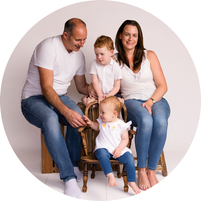 Parents with their two young children during a family photoshoot near Andover, Hampshire